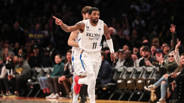 Kyrie Irving runs down the court.